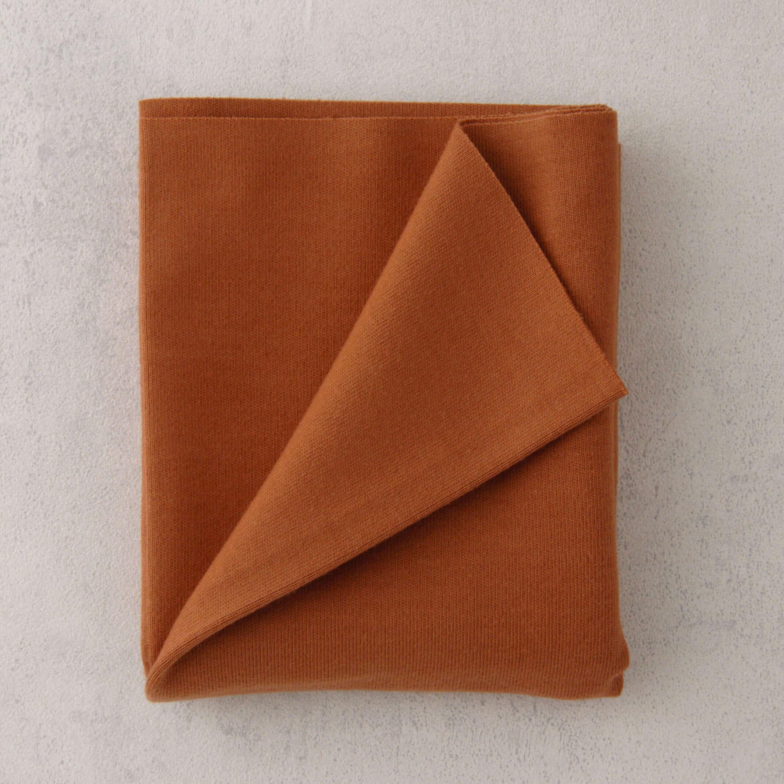 T106 Doll Jersey, 25x80 cm verpakt, Roodbruin